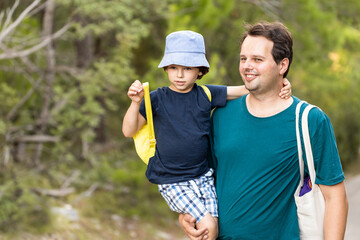 Father and son walking in the park