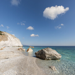 The spectacular Lalaria Beach with marble pebbles and crystal clear waters on the north coast of...