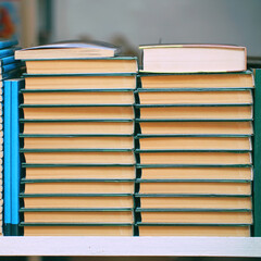 Stacks of books on a shelf in the library. Selective Focus