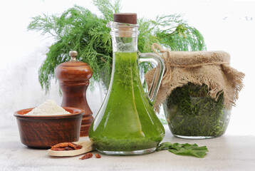 Vegetable oil with fresh dill and spices.