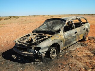 burnt car in the desert