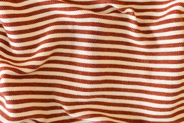 striped crumpled pattern on fabric. Red and white horizontal stripe. Background and backdrop