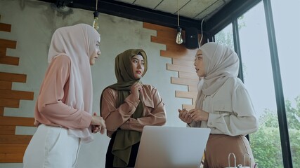 Young muslim workers female use laptop in meeting room