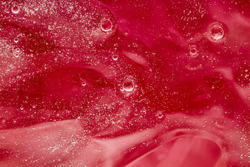 Abstract red liquid background, paint splash, swirl pattern and water drops, beauty gel and...