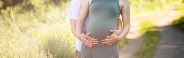 Man hold pregnancy belly, couple in nature. Motherhood, protection baby and new life concept.