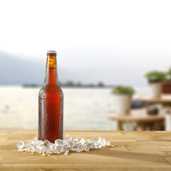 Summer beer on desk and sea landscape 