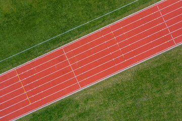 Aerial View of Red Running Track - Powered by Adobe
