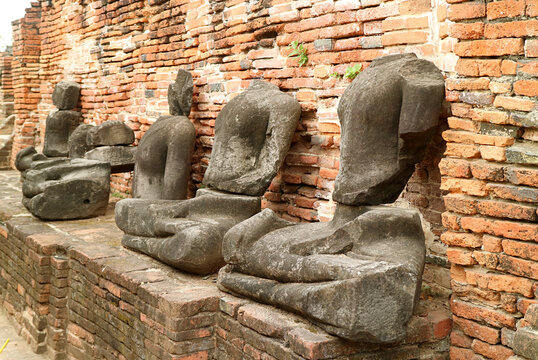 Group of Headless Buddha Images Ruins in Wat Mahathat Ancient Temple, Ayutthaya Historical Island, Ayutthaya, Thailand