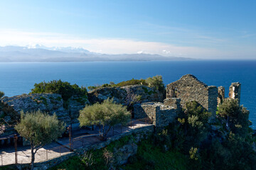 Fototapeta na wymiar Ruins in the village of Nonza with the Monte Cinto in the background, Cap Corse in Corsica, France
