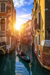 Obraz na płótnie Canvas Canal with gondolas in Venice, Italy. Architecture and landmarks of Venice. Venice postcard with Venice gondolas.