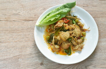 stir fried spicy wild boar and finger root with red curry on plate