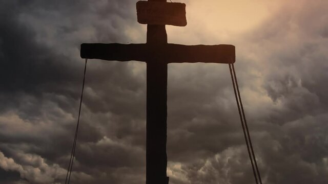 Wooden cross on a stormy day representing Sacrifice of Jesus Christ from Calvary hill, outside ancient Jerusalem.