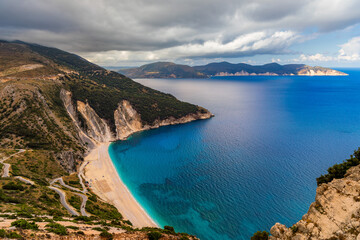 Fototapeta premium Aerial drone view of iconic turquoise and sapphire bay and beach of Myrtos, Kefalonia (Cephalonia) island, Ionian, Greece. Myrtos beach, Kefalonia island, Greece. Beautiful view of Myrtos beach.