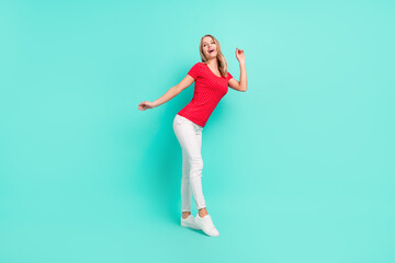 Fototapeta na wymiar Full length body size photo woman dancing looking empty space isolated bright teal color background