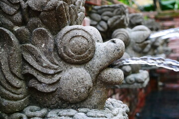 detail of a fountain with stone spouts
