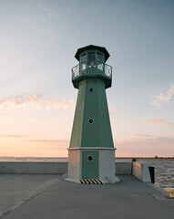 Green lighthouse in Gdansk, Poland during summer sunset. Small Green Lighthouse In the Gdansk Harbor of the Baltic sea