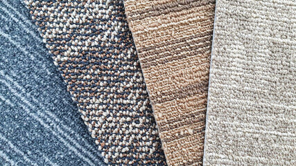 close up colorful carpet samples swatch for interior material selection. floor covering material samples. samples of multi-textured carpets.