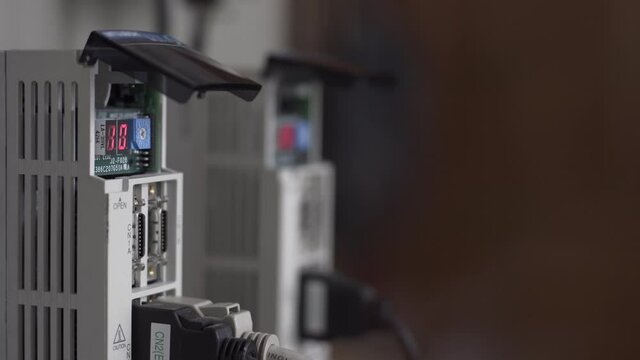 Stepper motor controllers with flashing LED indicator with the number 10, with free space for text on the right, close-up.