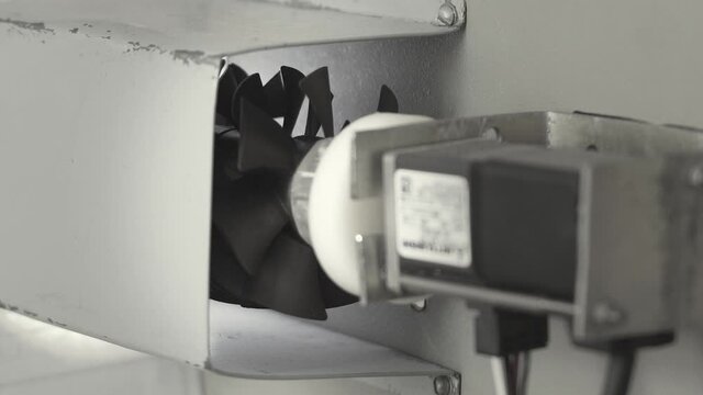 Stepper motor with blades in motion, close up.