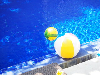 Beach ball floating above the pool
