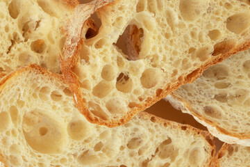 Slices of  ciabatta bread with yeast holes close-up
