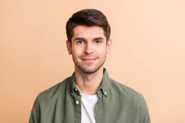 Photo of charming attractive young man face good mood smile isolated on pastel beige color background