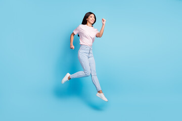 Full length profile side photo of young cheerful girl happy positive smile go walk run jump hurry...