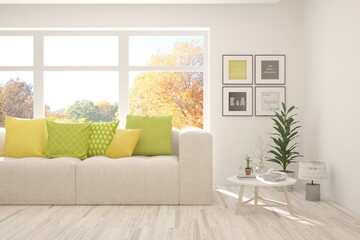 Naklejka premium Stylish room in white color with sofa and autumn landscape in window. Scandinavian interior design. 3D illustration