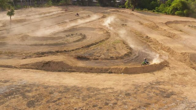 Aerial drone of motocross track with motorcycle racers training for competitions. Cagayan de Oro, Mindanao, Philippines.