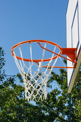 Basketball board with basket hoop on playground. Sport, recreation and healthy lifestyles on fresh air