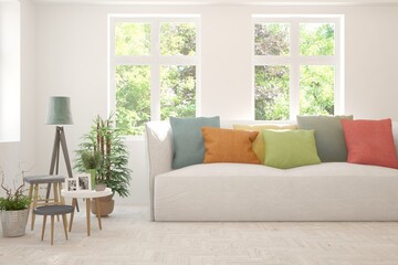 Minimalist living room in white color with sofa and summer landscape in window. Scandinavian interior design. 3D illustration