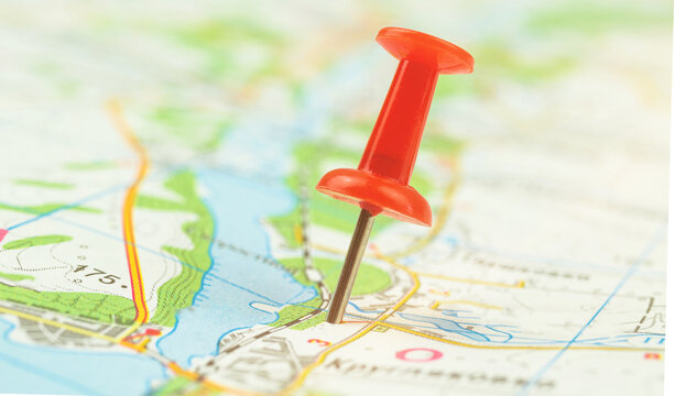 City navigation concept, red push pin on the map, cartography background photo