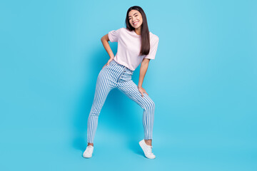 Fototapeta na wymiar Full body profile side photo of young asian cheerful girl happy positive smile lovely isolated over blue color background