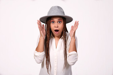 Fototapeta premium Attractive woman wearing hat with shocked expression on white background 