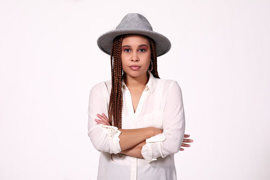 Portrait Of A Woman In Hat With Hands Folded On White Background 