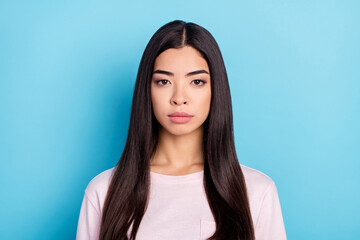 Photo of young attractive asian korean girl serious confident long brown hair isolated over blue...