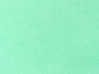 mint green velvet fabric texture used as background. Empty light orange fabric background of soft and smooth textile material. There is space for text.