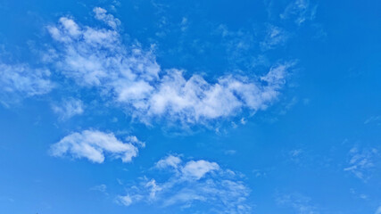 Naklejka na ściany i meble Smooth white clouds and blue sky for background.