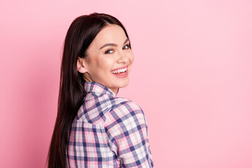 Fototapeta premium Photo of excited adorable young lady dressed checkered shirt empty space smiling isolated pink color background