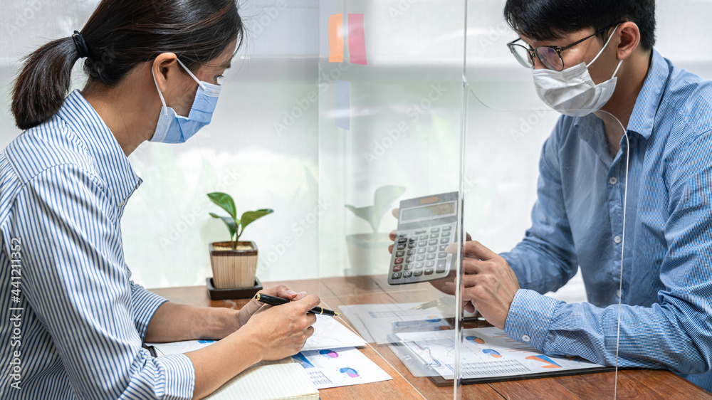 Poster asian business man showing investment amount on calculator to partner and discussion about new proje