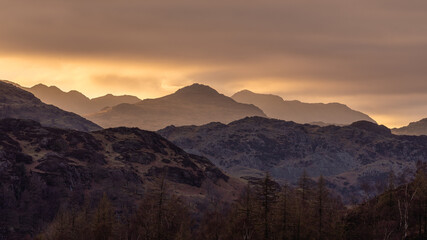 Fototapeta na wymiar Lake District mountain Layers Landscape at sunset with some moody skies.