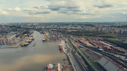 Aerial view of high-tech modern seaport with cranes and loaders