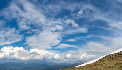 Panorama of the Carpathian mountains at the beginning of summer in Ukraine, rest and travel in the mountains