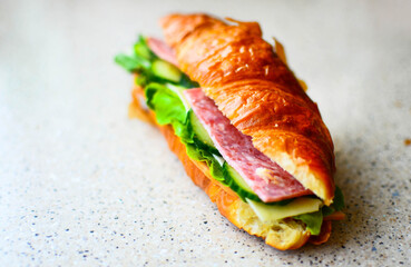 Delicious croissant with butter and salad
