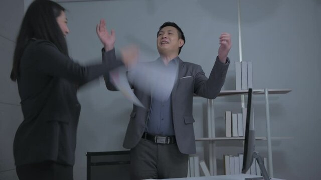 Business concept of 4k Resolution. Asian men and women rejoice in their success in the office.