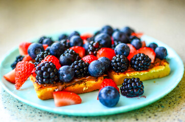 Delicious Waffles with fresh berries and chocolate