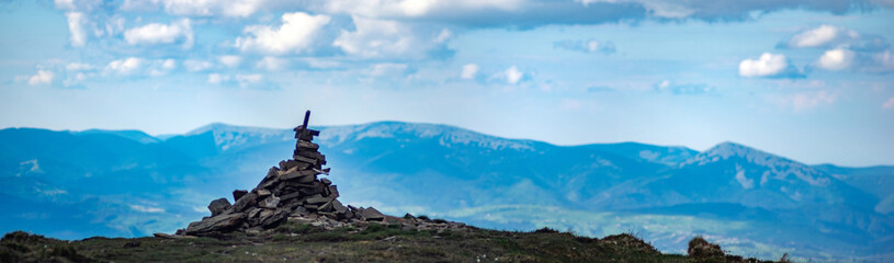 A pile of stones on a mountain top in the carpathian mountains in summer