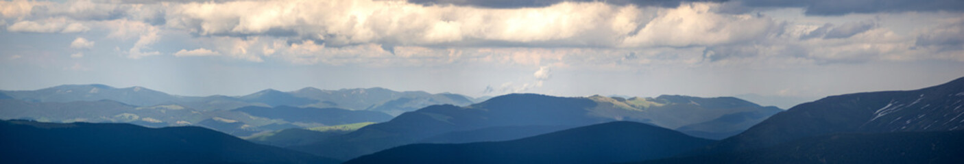 Mountain range in the Ukrainian carpathians on a spring day. Rest and travel in the mountains.