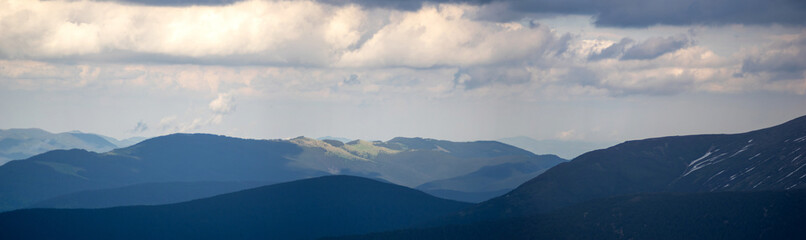 Mountain range in the Ukrainian carpathians on a spring day. Rest and travel in the mountains.
