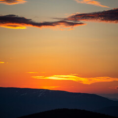 Panorama, smoky silhouette of the Carpathian mountains at sunset
